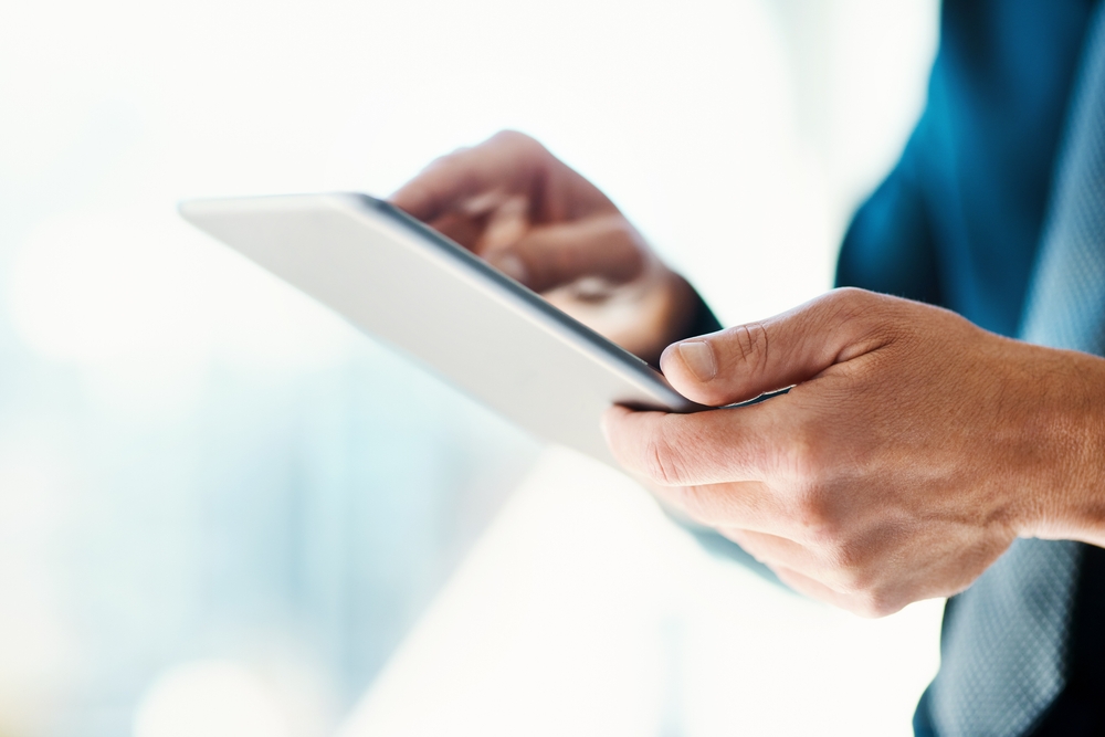 person working on the TMS system on a tablet