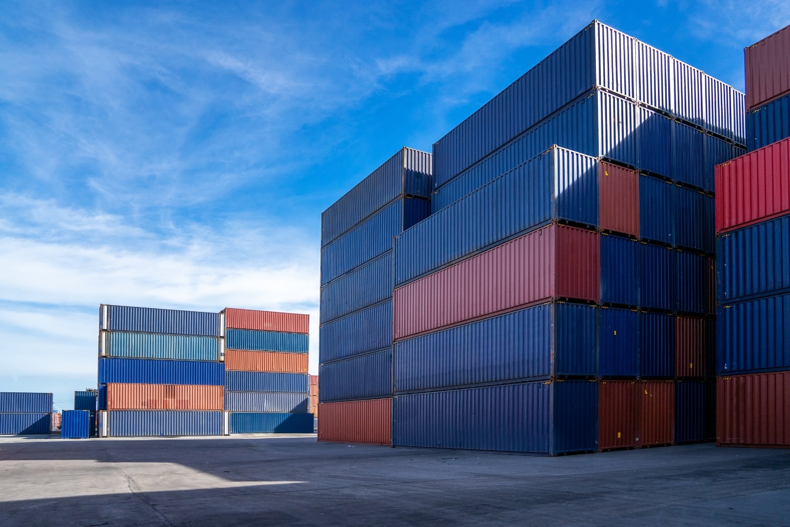 containers stacked on top of each other ready for train or truck transportation